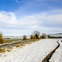 Buy canvas prints of Winter Scenes in Wiltshire a snow covered field at by Paul Chambers