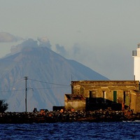 Buy canvas prints of Lighthouse and vulcano. by Pietro Magnabosco