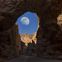 Buy canvas prints of Moon Through Rock Arch by Reg K Atkinson