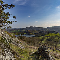 Buy canvas prints of Loughrigg Tarn and Crag Head by Reg K Atkinson