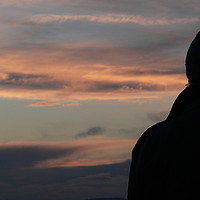Buy canvas prints of Silhouette of A man enjoying the sunset sky by Jackson Photography