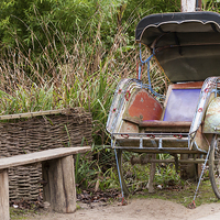 Buy canvas prints of  Rickshaw next to a bench by Jurgen Schnabel
