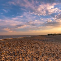 Buy canvas prints of Sun Setting on Walberswick Beach by Nick Rowland