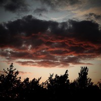 Buy canvas prints of  A Shropshire Sunset, reflected on dark clouds by CJ Allen