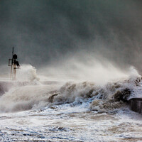 Buy canvas prints of Storm waves breaking over the harbour arm at Hastings  by Paul Praeger