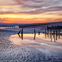 Buy canvas prints of Sunset reflections at low tide by Paul Praeger