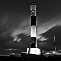 Buy canvas prints of  Dungeness Lighthouse standing defiant ! by Trevor Kerr