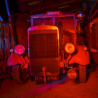 Buy canvas prints of vintage Fire engine bathed in red light by andrew blakey
