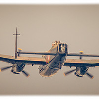 Buy canvas prints of Lancaster Bomber Heading home by andrew blakey