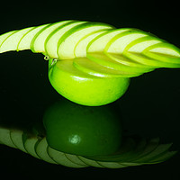 Buy canvas prints of carved green apple by andrew blakey