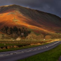 Buy canvas prints of Helm Crag, Lake District, Bathed in Golden Light by Pete Watson