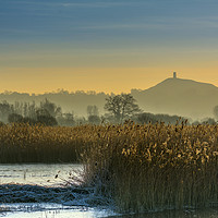 Buy canvas prints of Glastonbury Tor shrouded in early morning mist. by Pete Watson