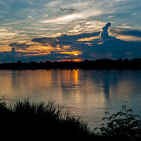 Buy canvas prints of Mekong Sunset by Annette Johnson