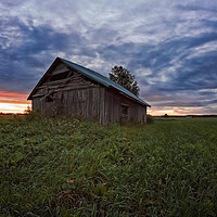 Buy canvas prints of Sunset Clouds And An Old Barn House by Jukka Heinovirta