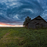 Buy canvas prints of Circle Of Clouds Over The Old Barn House by Jukka Heinovirta
