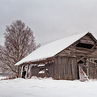 Buy canvas prints of Abandoned Barn House Covered With Snow by Jukka Heinovirta