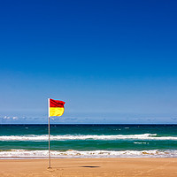 Buy canvas prints of Lonely Life Saver Flag On Australian Beach by Jukka Heinovirta