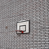 Buy canvas prints of Basketball Hoop On A Brick Wall by Jukka Heinovirta