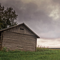 Buy canvas prints of Dramatic Clouds Over The Barn House by Jukka Heinovirta