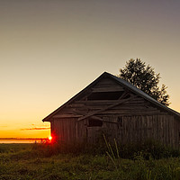 Buy canvas prints of Midsummer Sunset Behind A Barn House by Jukka Heinovirta