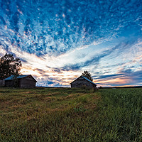 Buy canvas prints of Two Old Barn Houses In The Late Summer Sunset by Jukka Heinovirta