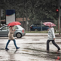 Buy canvas prints of Two Umbrellas In The Crossing by Jukka Heinovirta