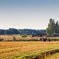 Buy canvas prints of Old Tractor On The Fields by Jukka Heinovirta
