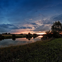 Buy canvas prints of Autumn Sunset By The River by Jukka Heinovirta
