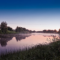 Buy canvas prints of Mist over the river water on a Summer Night by Jukka Heinovirta