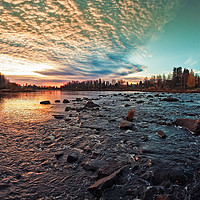 Buy canvas prints of Dramatic Sunset By The River by Jukka Heinovirta