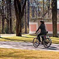 Buy canvas prints of Riding A Bike In The Park by Jukka Heinovirta
