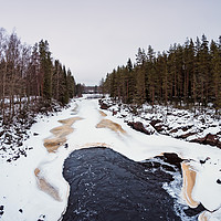 Buy canvas prints of Waves In The Freezing River by Jukka Heinovirta