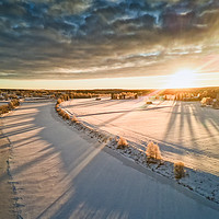 Buy canvas prints of Sunrise Over The Winter Fields by Jukka Heinovirta