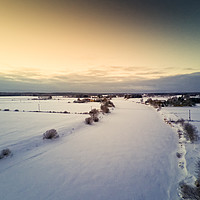 Buy canvas prints of Sunset Over Icy River Bend by Jukka Heinovirta