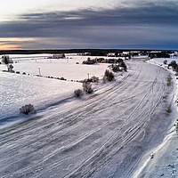 Buy canvas prints of Aerial View Of The Icy River by Jukka Heinovirta