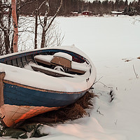 Buy canvas prints of Old Fishing Boat Covered With Snow by Jukka Heinovirta