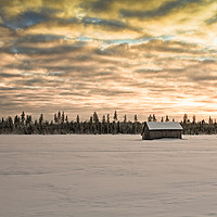 Buy canvas prints of Sunset Over The Snow Covered Fields by Jukka Heinovirta