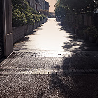 Buy canvas prints of Narrow Alley In Bright Sunlight by Jukka Heinovirta