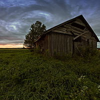 Buy canvas prints of Round Clouds Over An Old Barn House by Jukka Heinovirta