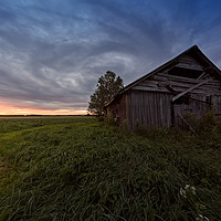 Buy canvas prints of Dramatic Clouds Over An Old Barn House by Jukka Heinovirta