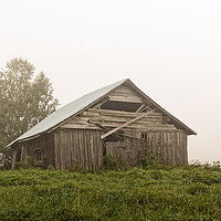 Buy canvas prints of Old Barn House On a Foggy Summer Morning by Jukka Heinovirta