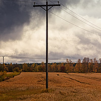 Buy canvas prints of Telephone Pole Under The Heavy Clouds by Jukka Heinovirta