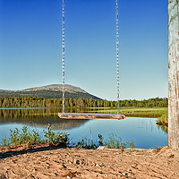Buy canvas prints of Wooden Swing By A Lake by Jukka Heinovirta