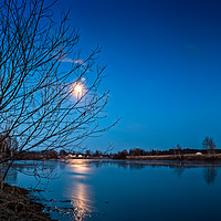 Buy canvas prints of Full Moon Over The River by Jukka Heinovirta