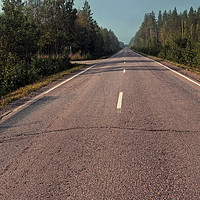 Buy canvas prints of Empty Road On A Misty Morning by Jukka Heinovirta