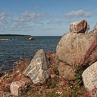 Buy canvas prints of Pile Of Rocks By The Sea by Jukka Heinovirta