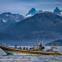 People at boat sailing at lago puelo lake, chubut province, argentina