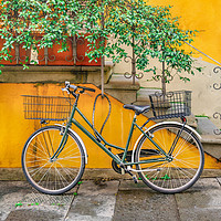 Buy canvas prints of Bicycle Parked at Wall, Lucca, Italy by Daniel Ferreira-Leite