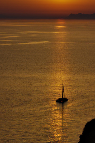 Boat in the Sunset at Oia Picture Board by Jeremy Hayden
