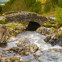 Buy canvas prints of Ashness Bridge on a cloudy day. by Paul Cullen